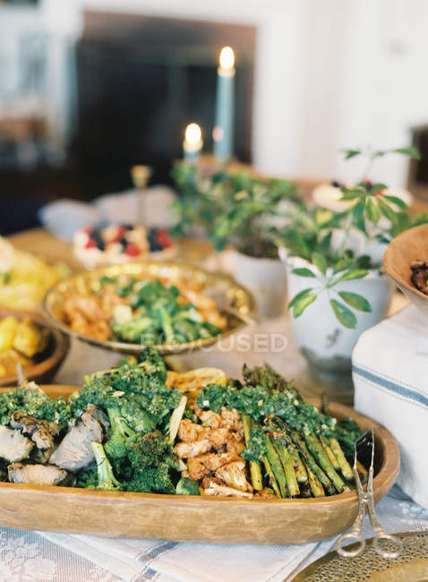 Food on dinner setting table — Stock Photo
