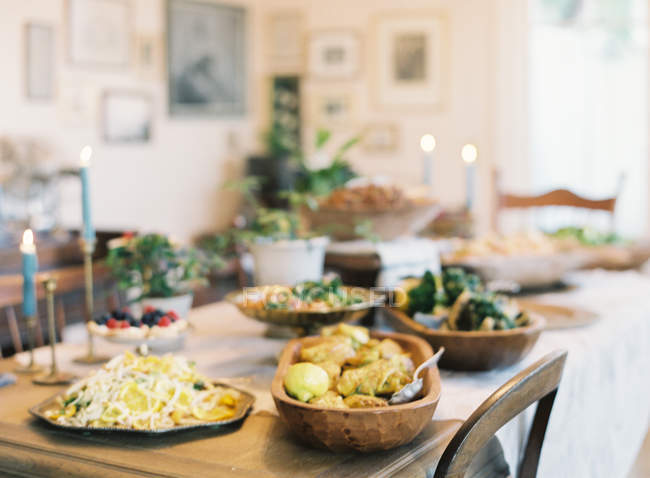Food on dinner setting table — Stock Photo