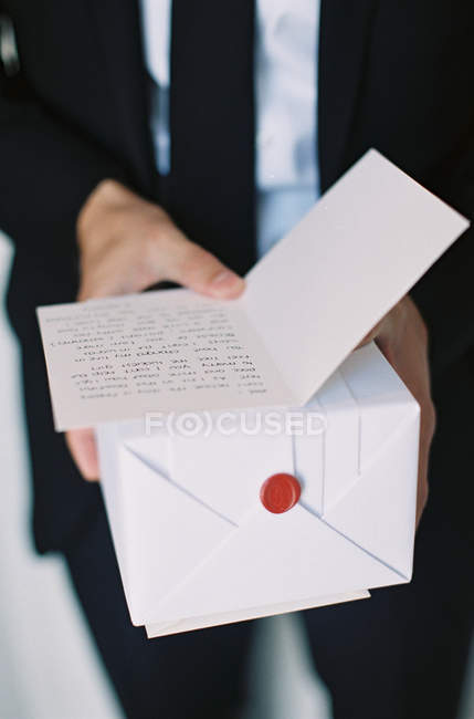 Man holding white gift box — Stock Photo