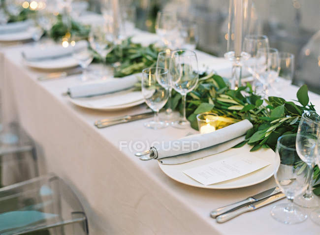 Setting table decorated with branches — Stock Photo