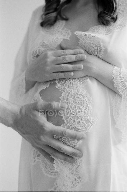 Father hand on pregnant woman — Stock Photo