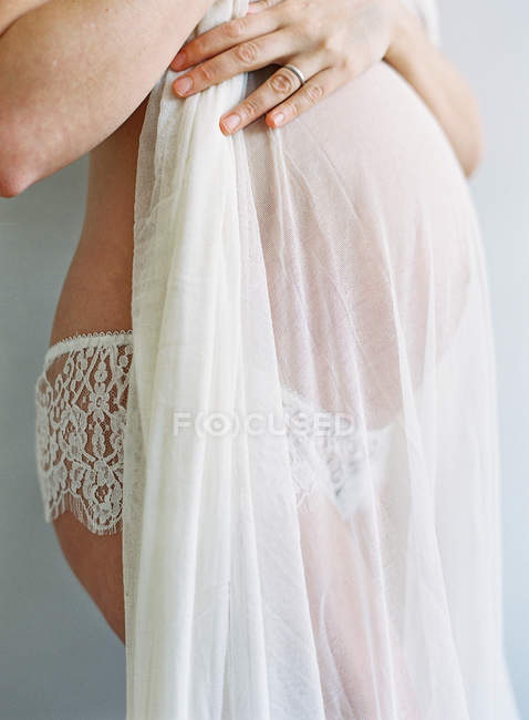 Pregnant woman in boudoir — Stock Photo