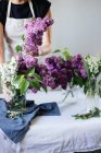 Lilac flowers in glass jar — Stock Photo