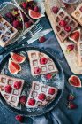 Waffles with raspberries on tray — Stock Photo