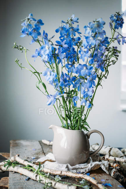 Flowers in glass jar — Stock Photo