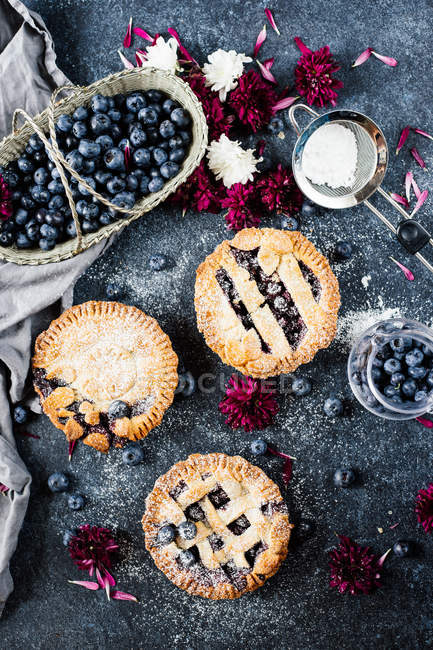 Homemade blueberry pies on table — Stock Photo