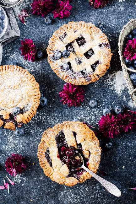 Homemade blueberry pies on table — Stock Photo