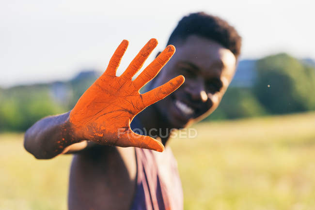 African american man showing hand in dust — Stock Photo