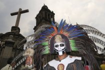 Aztec warrior dancer in front of Cathedral — Stock Photo