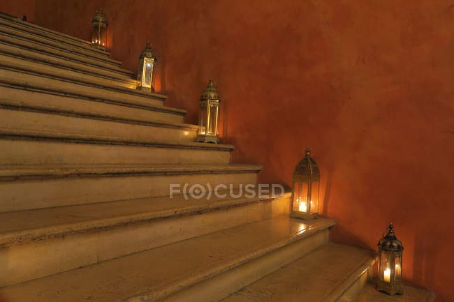 Staircase with glass gaslights on steps — Stock Photo