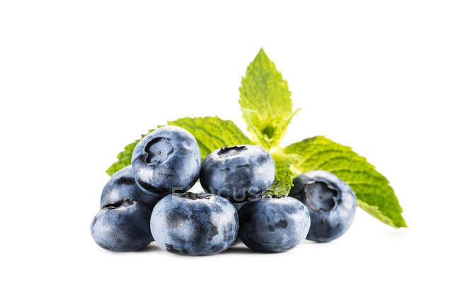Pile of blueberries with mint leaves — Stock Photo