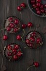 Chocolate cheery cupcakes before baking — Stock Photo