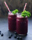 Two glass jars with blueberry smoothie — Stock Photo