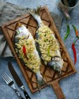 Two carp fish baked with onions — Stock Photo