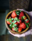 Wooden bowl with fresh strawberries — Stock Photo
