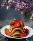 Stack of pancakes with strawberries — Stock Photo