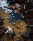 Chocolate, cacau em pó, nozes e sal — Fotografia de Stock