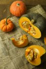 Whole and cut pumpkins — Stock Photo