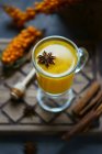 Sallowthorn fruit drink with anise star — Stock Photo