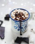Closeup view of metal cup of drink with marshmallows and chocolate — Stock Photo