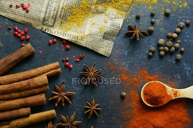 Different herbs and spices on table — Stock Photo