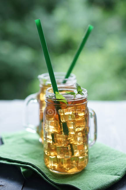 Two glass mugs of apple juice — Stock Photo