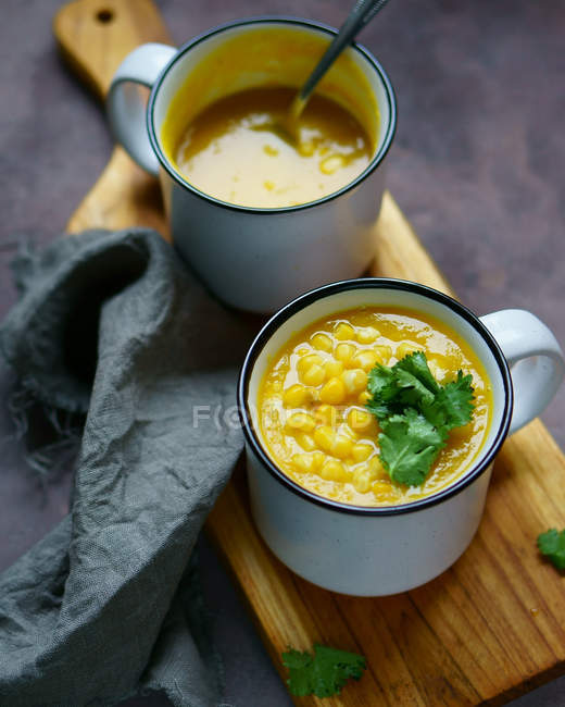 Cups of corn soup — Stock Photo