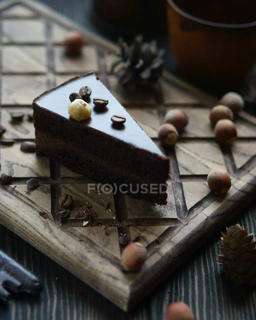 Chocolate cake with coffee beans and nuts — Stock Photo