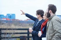 Design team pointing outside — Stock Photo