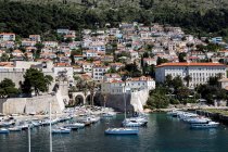 Coastal cityscape with city walls and yacht marina — Stock Photo