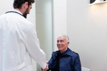 Patient shaking hands with doctor — Stock Photo