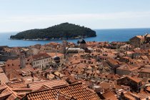 Rooftop cityscape of town and Lokrum island — Stock Photo