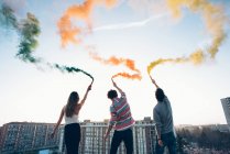 Group of friends on roof — Stock Photo