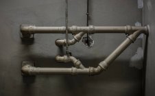 Industrial pipes on wall — Stock Photo