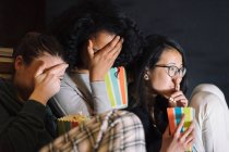 Friends watching scary movie — Stock Photo