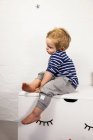 Male toddler sitting — Stock Photo