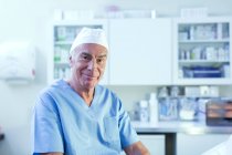 Doctor looking at camera smiling — Stock Photo