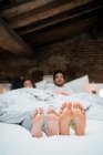Bare feet soles of young couple — Stock Photo