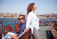 Tourist couple on passenger ferry deck — Stock Photo