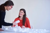 Colleagues looking at architectural model — Stock Photo