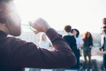 Friends enjoying roof party — Stock Photo
