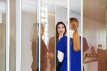 Businesswomen standing having discussion — Stock Photo