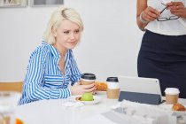 Female architect looking at architectural model — Stock Photo