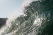Rolling wave and beach — Stock Photo