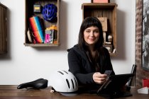 Woman in cycling accessories shop — Stock Photo