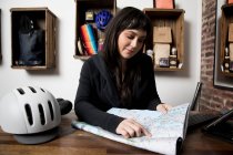 Woman in cycling accessories shop — Stock Photo