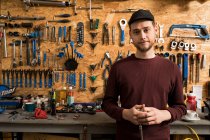 Technician in bicycle workshop — Stock Photo