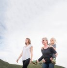 Woman walking with daughter and grandson — Stock Photo