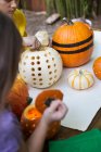 Girl and brother preparing pumpkins — Stock Photo