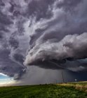 Rotating supercell clouds over rural area — Stock Photo